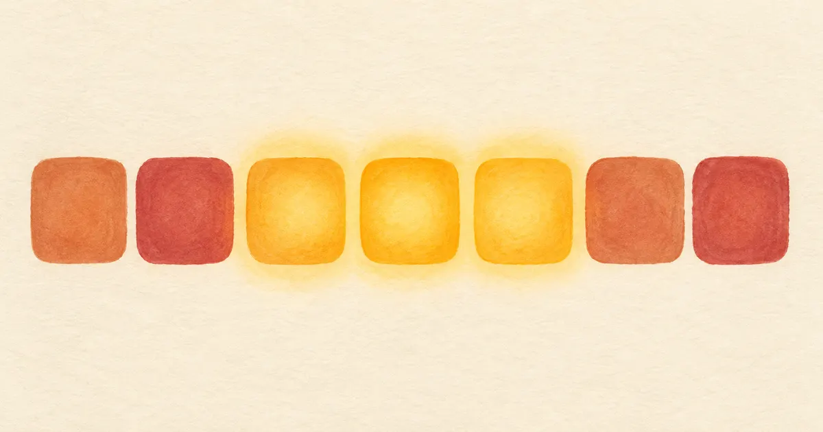 A row of rounded tiles with three glowing amber